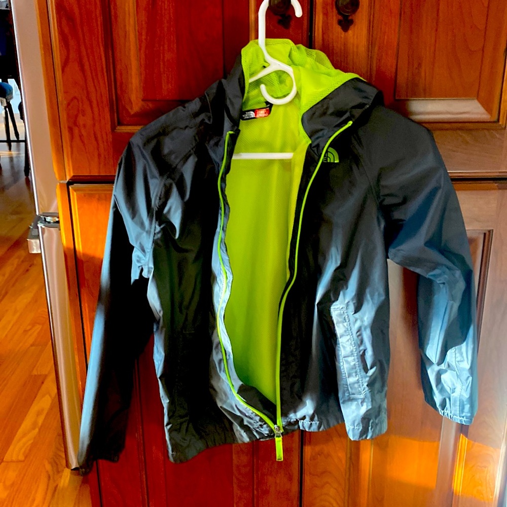 Grey/green rain coat.  Excellent condition size 10/12.  North face